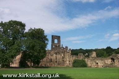 Abbey Ruins seen from bank of the River Aire